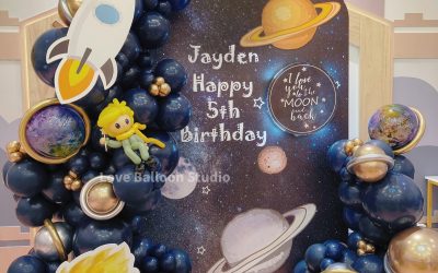 A Cosmic Space Themed Balloon Installation with Galaxy and Rocket Elements