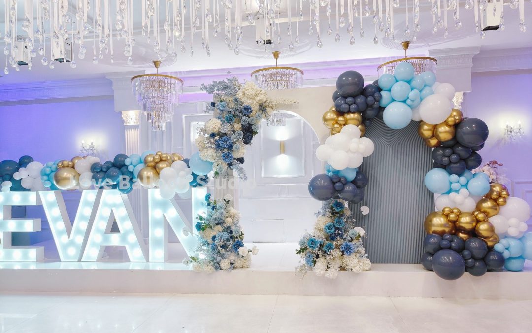 Blue and Gold Balloon and Floral Backdrop with Illuminated Letters