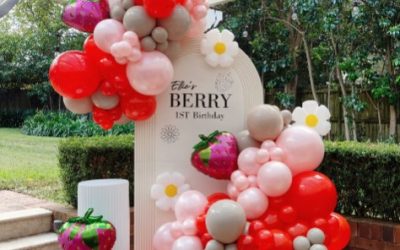 A Fresh Strawberry-Inspired Balloon Installation with Playful Floral Details