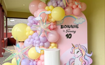 A Dreamy Pastel Balloon Installation with Unicorn and Rainbow Elements