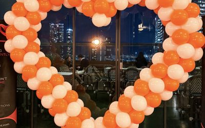 Vibrant Orange & White Heart-Shaped Balloon Arch Styling