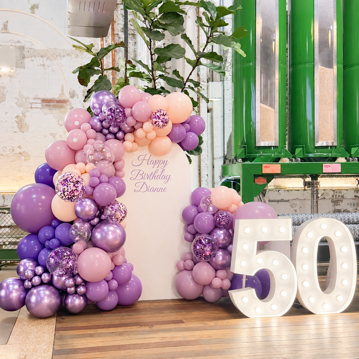 Purple-themed 50th birthday setup, featuring 1-metre-tall illuminated number lights